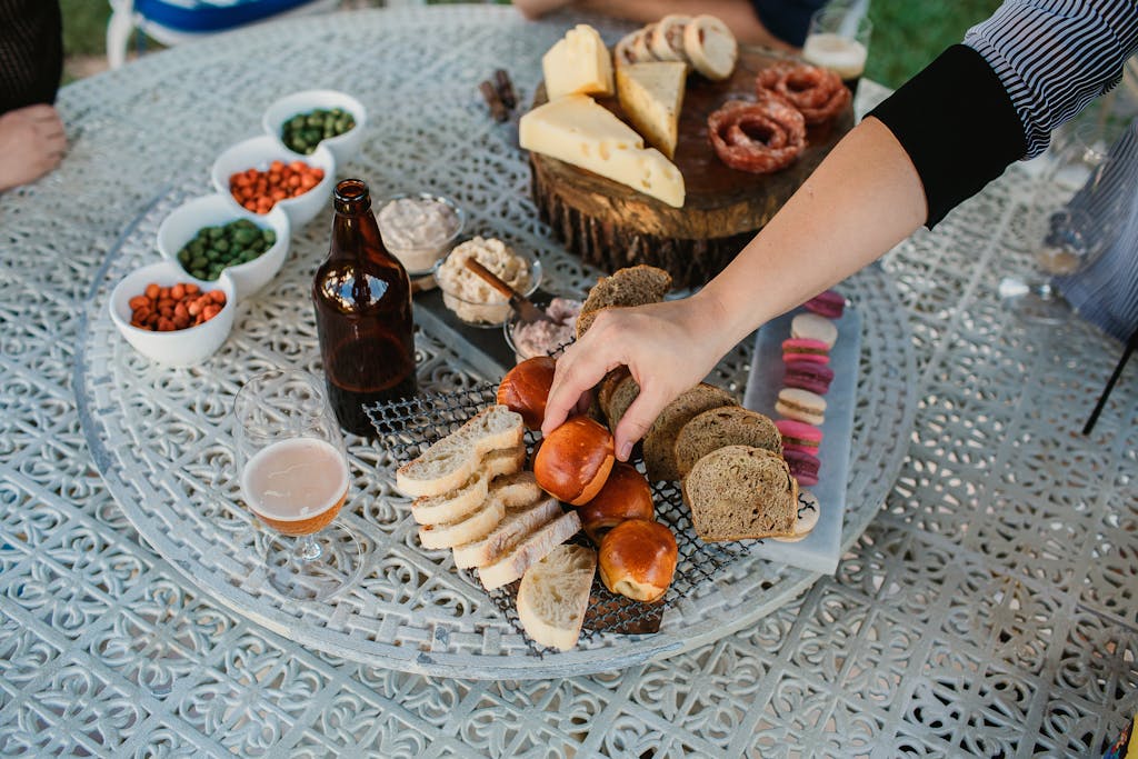 A farm-to-table outdoor dining spread with fresh plant-based dishes on a rustic elegant table representing luxury vegetarian culinary travel experiences